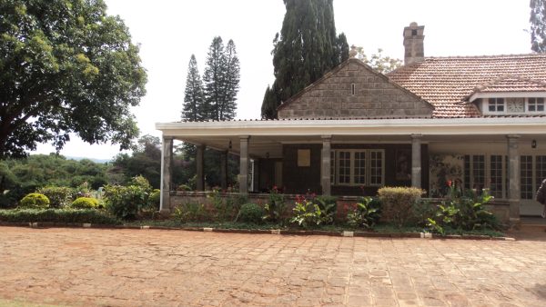 Tourist vehicles parked at the Karen Blixen Museum car park in Nairobi, Kenya​
