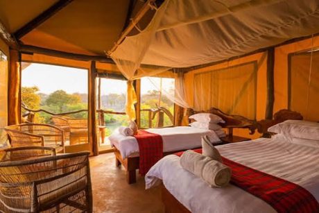 Luxury family safari tent with twin beds, private veranda, and panoramic views of the Maasai Mara at Sentrim Mara Camp, Kenya, offered by Cruzeiro Safaris Kenya.