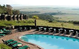 Infinity swimming pool at Mara Serena Safari Lodge overlooking the expansive savannah of Masai Mara.