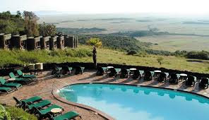 Infinity swimming pool at Mara Serena Safari Lodge overlooking the expansive savannah of Masai Mara.