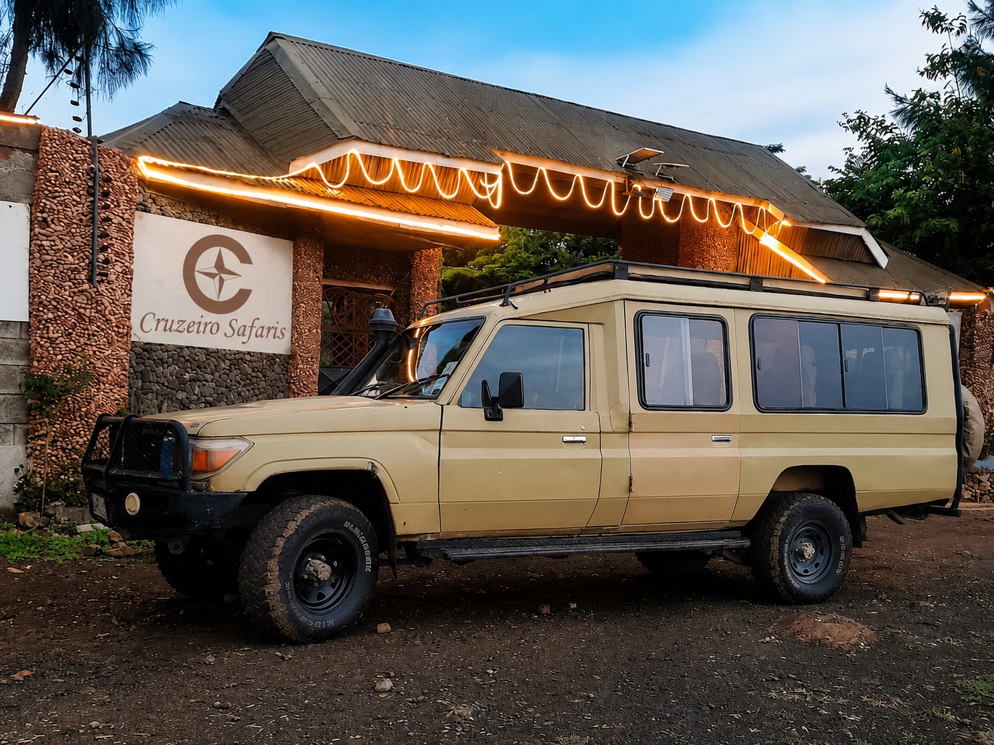 Cruzeiro Safaris Kenya 4x4 Land Cruiser parked in Amboseli National Park, offering private safari game drives with panoramic wildlife viewing and experienced local guides.